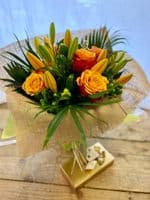 Lily and Rose Vase arrangement includes Chocolates