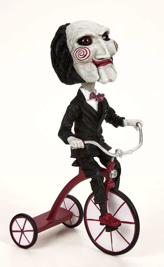 SAW BILLY THE PUPPET ON TRICYCLE HEADKNOCKER