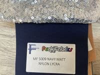 High front leotard with keyhole back and sequin skirt on silver waistband