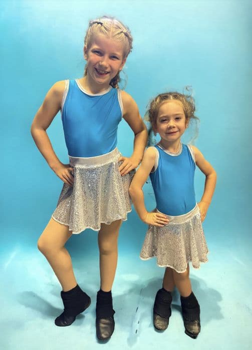 High front leotard with keyhole back and sequin skirt on silver waistband