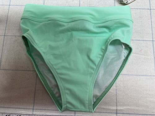 Knicks. Mint Green Fully lined. Age 7-8