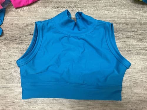 RTG high neck sleeveless crop top. Turquoise front lined. Age 5-6