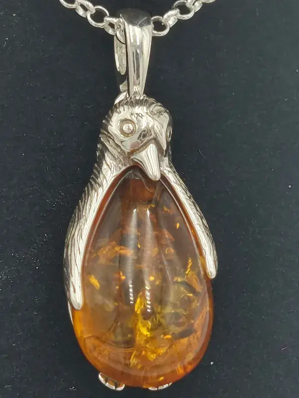Amber penguin pendant