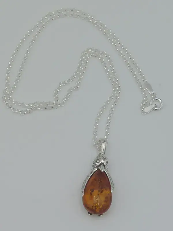 Amber penguin pendant