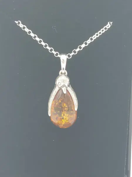 Amber penguin pendant