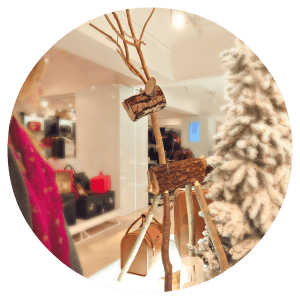 Custom size 6' floor standing wooden log deer for VM and hospitality settings from The Log Basket