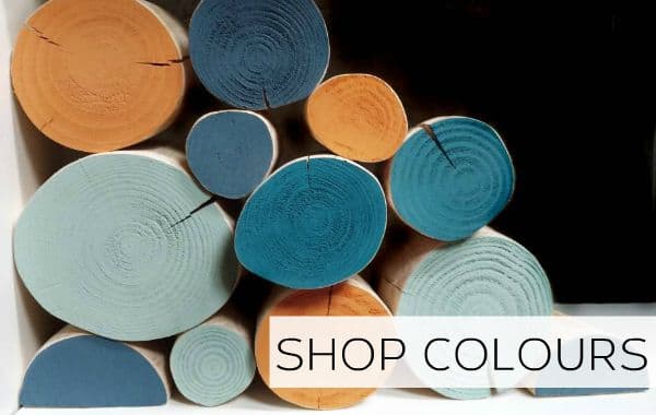 Decorative logs in a range of colours and finishes from The Log Basket for a unique log stack feature in a media wall or unused fireplace