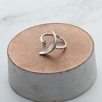 A beautiful and delicate sterling silver bamboo adjustable ring with tiny zircon stones at each end.