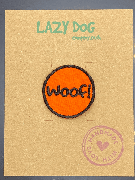 Embroidered Iron on Orange Woof! Badge for Dogs by Lazy Dog Company.
