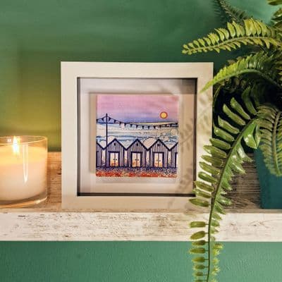 Coastal Retreat Row of Beach Huts Small Picture