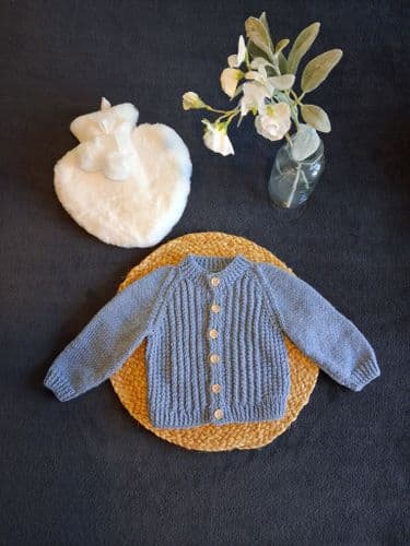 Babies Round Neck Twist Cardigan Knitting Pattern | Family Business Established 1949 | Knitwell Wools