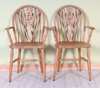 2 Wheel Back Carver Chairs