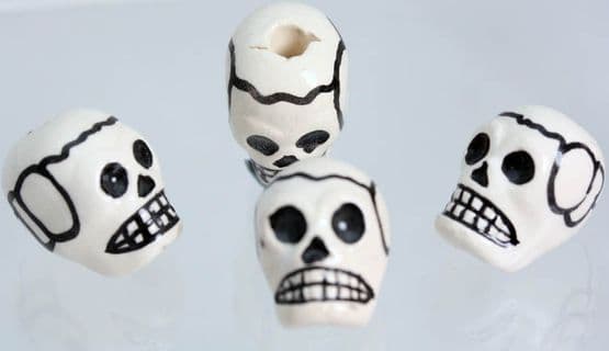GLAZED SKULL -hole top to bottom from 0.42p