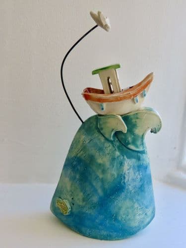 Boat on Crest of Wave