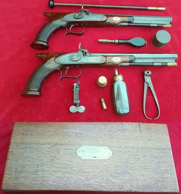 *A cased pair of saw-handled Percussion Duelling pistols by COLE super condition. FOR SALE. Ref 1674