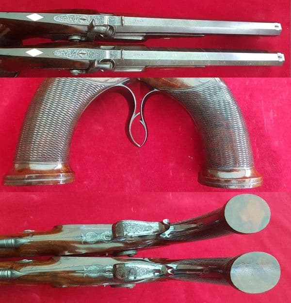 *A cased pair of saw-handled Percussion Duelling pistols by COLE super condition. FOR SALE. Ref 1674
