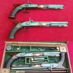 *A cased pair of saw-handled Percussion Duelling pistols by COLE super condition. FOR SALE. Ref 1674