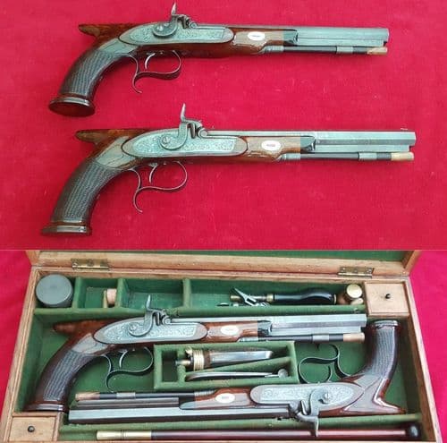 *A cased pair of saw-handled Percussion Duelling pistols by COLE super condition. FOR SALE. Ref 1674