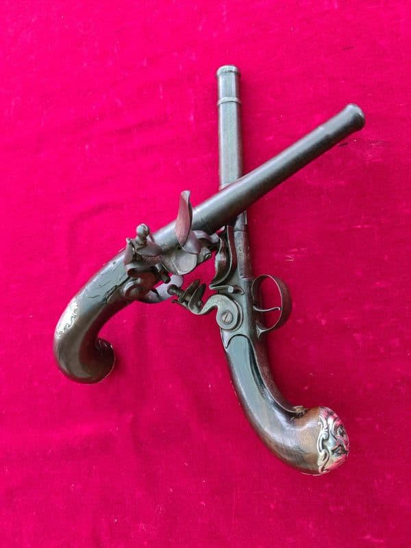 A fine pair of  Queen Anne silver mounted flintlock pistols by HAWKS of OXFORD. C.1760. Ref 3732.
