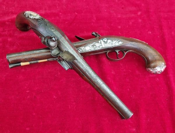 A rare pair of English silver mounted flintlock pistols by COLLUMBELL. Circa 1735-1765. Ref 4165.