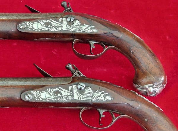 A rare pair of English silver mounted flintlock pistols by COLLUMBELL. Circa 1735-1765. Ref 4165.