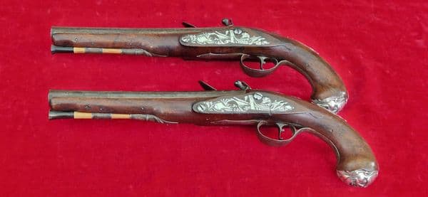 A rare pair of English silver mounted flintlock pistols by COLLUMBELL. Circa 1735-1765. Ref 4165.