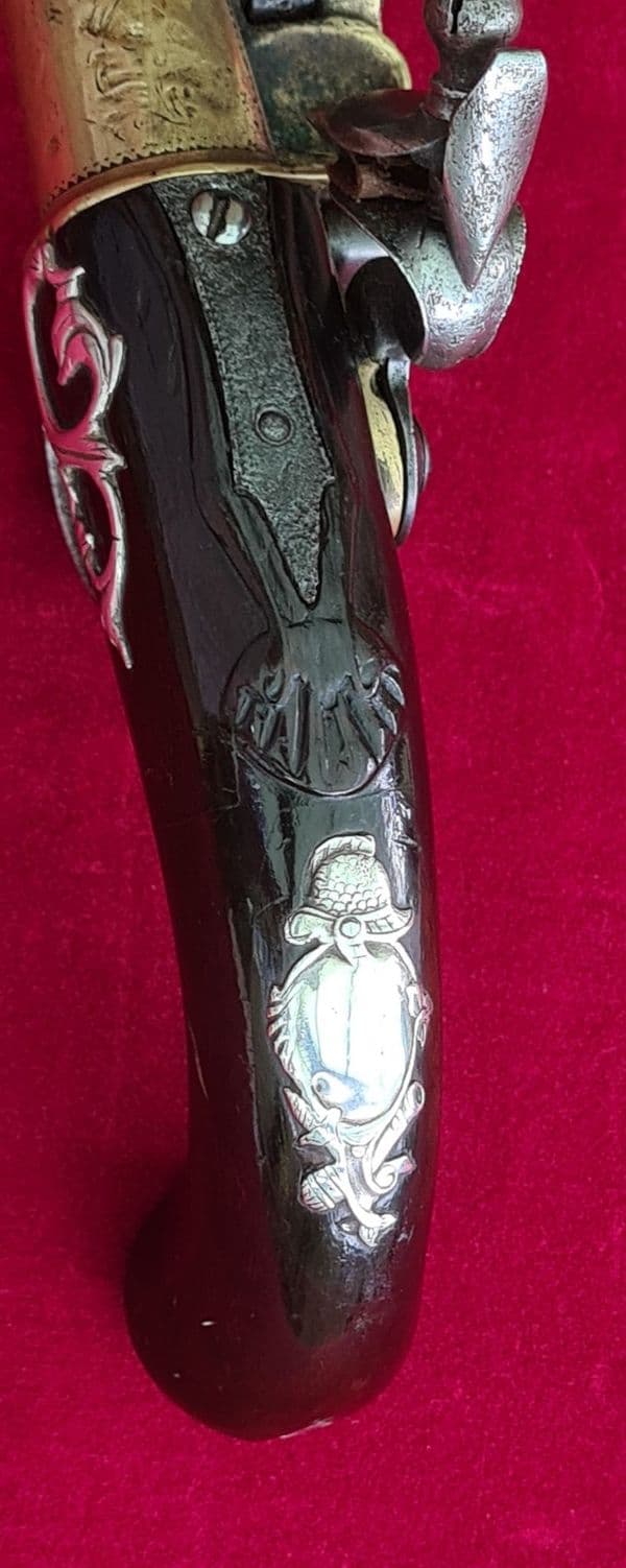 A rare Queen Anne style brass framed Silver mounted Flintlock pistol by HEYLIN LONDON. Ref 4029.