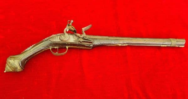 A scarce Turkish Flintlock pistol with embossed Silver decoration.  Ref 3325