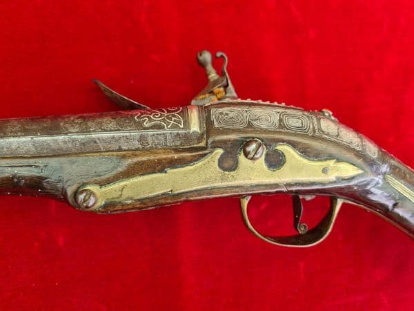 A scarce Turkish Flintlock pistol with embossed Silver decoration.  Ref 3325
