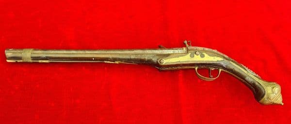 A scarce Turkish Flintlock pistol with embossed Silver decoration.  Ref 3325