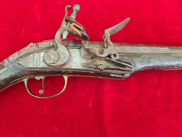 A scarce Turkish Flintlock pistol with embossed Silver decoration.  Ref 3325
