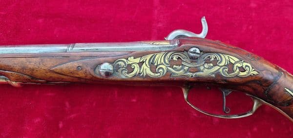 A very long German single shot percussion pistol made by DAVNER of BIBERACH. C. 1720-1750. Ref 3885.