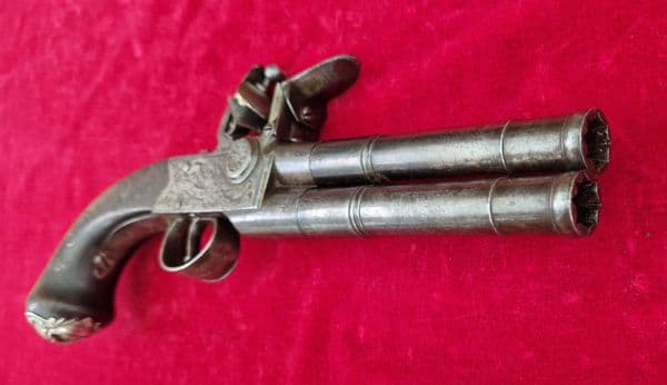 An English Queen Anne silver mounted double barrel flintlock pistol by Richards circa 1760. Ref 4409
