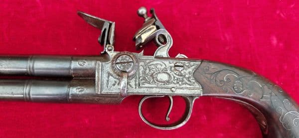 An English Queen Anne silver mounted double barrel flintlock pistol by Richards circa 1760. Ref 4409