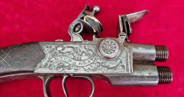 An English Queen Anne silver mounted double barrel flintlock pistol by Richards circa 1760. Ref 4409
