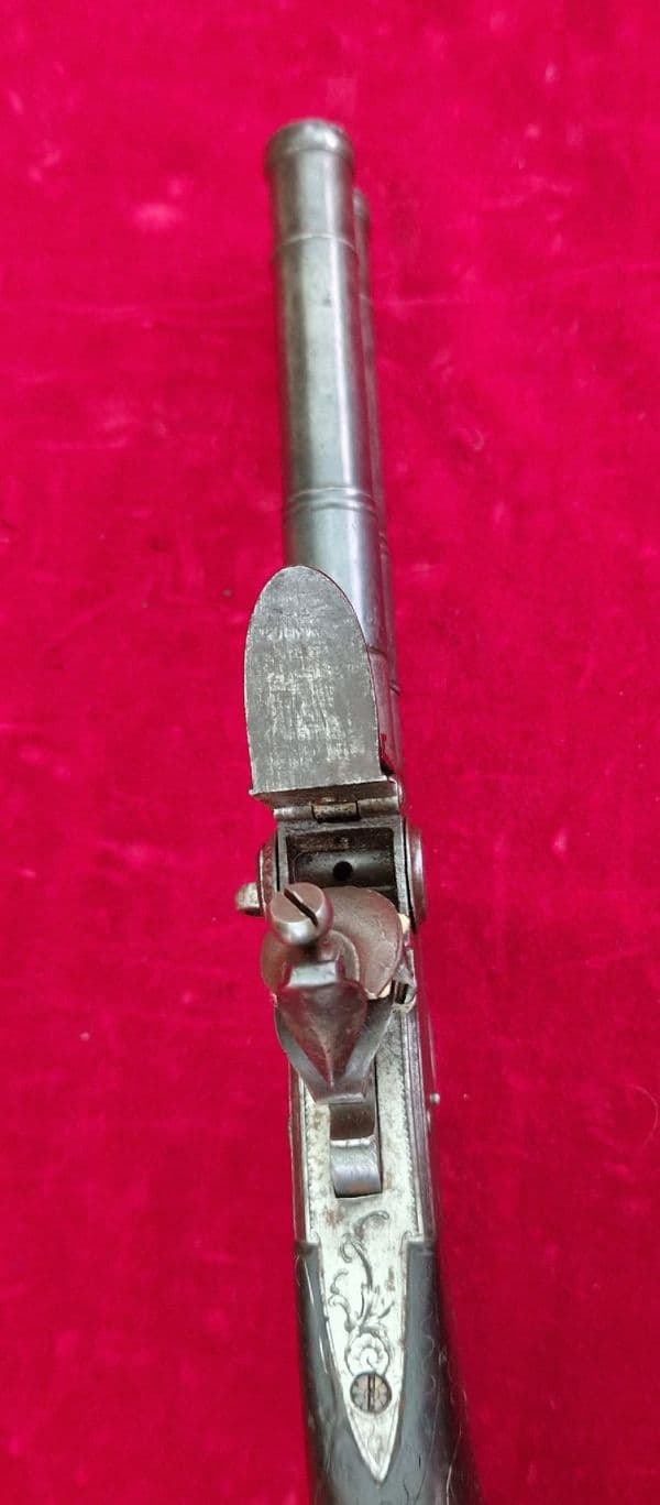 An English Queen Anne silver mounted double barrel flintlock pistol by Richards circa 1760. Ref 4409