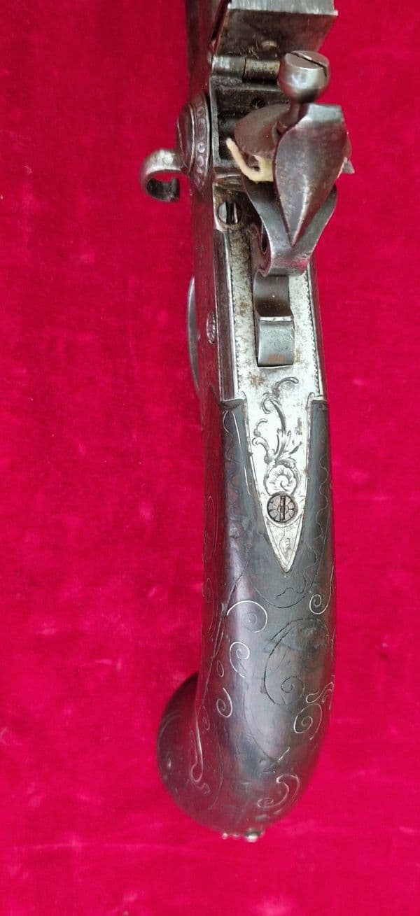 An English Queen Anne silver mounted double barrel flintlock pistol by Richards circa 1760. Ref 4409
