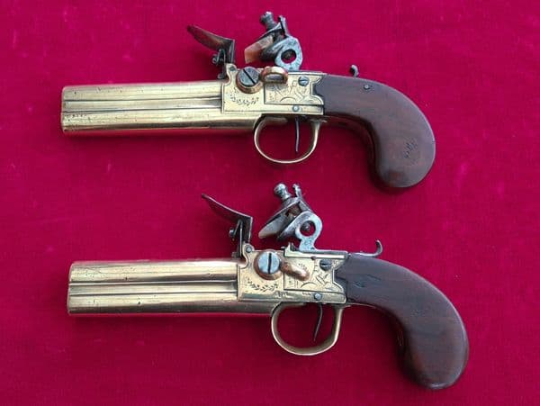 Pair of French over & Under double barrel brass tap action flintlock pistols. Circa 1780. Ref 3484