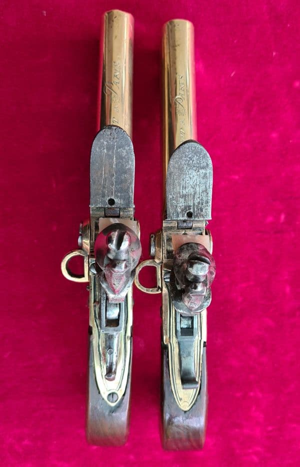 Pair of French over & Under double barrel brass tap action flintlock pistols. Circa 1780. Ref 3484
