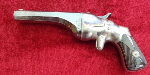 X X SOLD X X A HAMMOND BULLDOG single shot rimfire Derringer, retaining much finish. Ref 9851.
