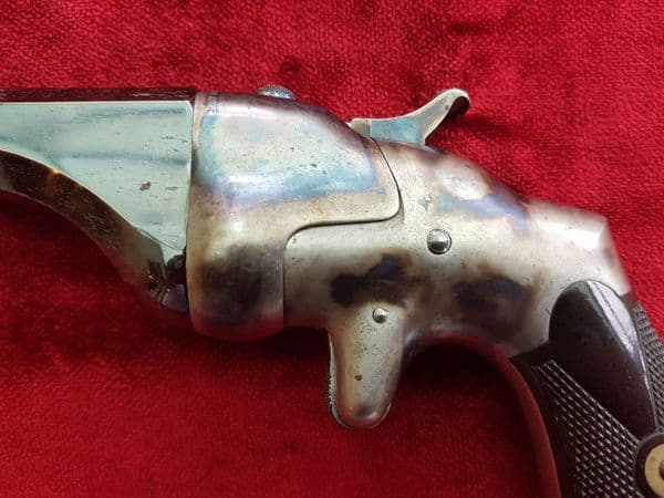 X X SOLD X X A HAMMOND BULLDOG single shot rimfire Derringer, retaining much finish. Ref 9851.