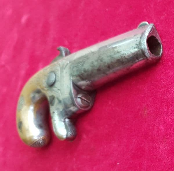 X X SOLD X X X  A  Moore's patent Derringer in .41 rim-fire calibre. C. 1860-1865. Ref 1486.