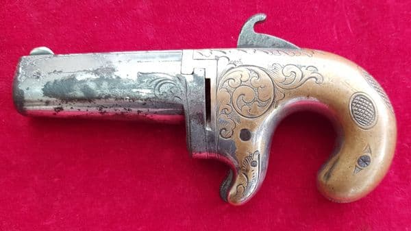 X X SOLD X X X  A  Moore's patent Derringer in .41 rim-fire calibre. C. 1860-1865. Ref 1486.