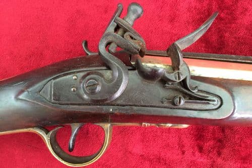 X X X SOLD X X A brass barrelled English Flintlock Blunderbuss with a top spring bayonet, made by