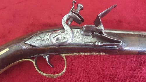 X X X SOLD X X An unusually long Balkan flintlock pistol with a 13 inch barrel and embossed brass