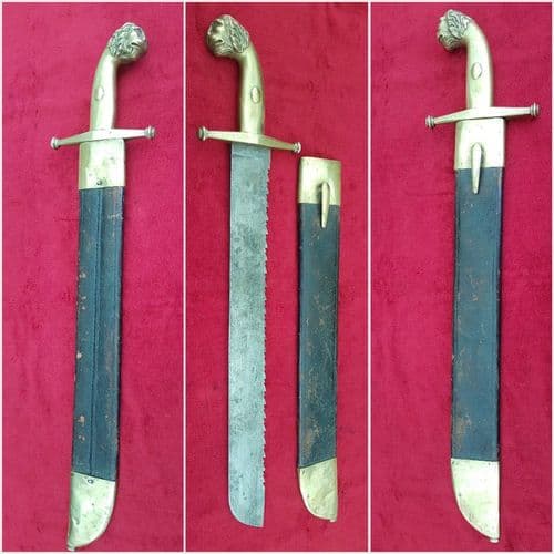 X X X SOLD X X   Brass sword saw-back blade & massive Lion's head pommel. Good condition. Ref 9959.