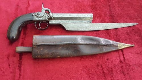 X X X SOLD X X Percussion knife-pistol with belt hook and leather scabbard Circa 1840-1850.Ref 8141.