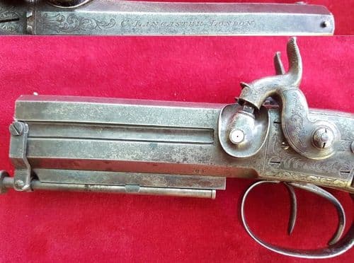 X X X  SOLD X X X A double barrel over/under percussion pistol by Charles Lancaster. Ref 1669.