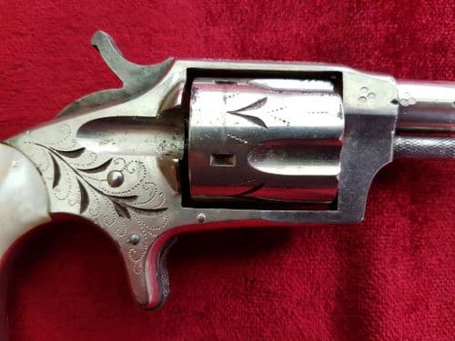 X X X SOLD X X X A Hopkins & Allen rimfire revolver with mother-of-pearl grips. c. 1875. Ref 9652.