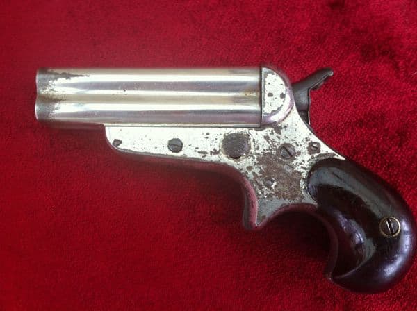 X X X  SOLD X X X  A Rare 4 brld Sharps rimfire Derringer, nickel plated, Bird's head grip. Obsolete